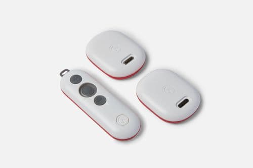 A photo of the GaitQ Tempo controller and two pods on a white background.