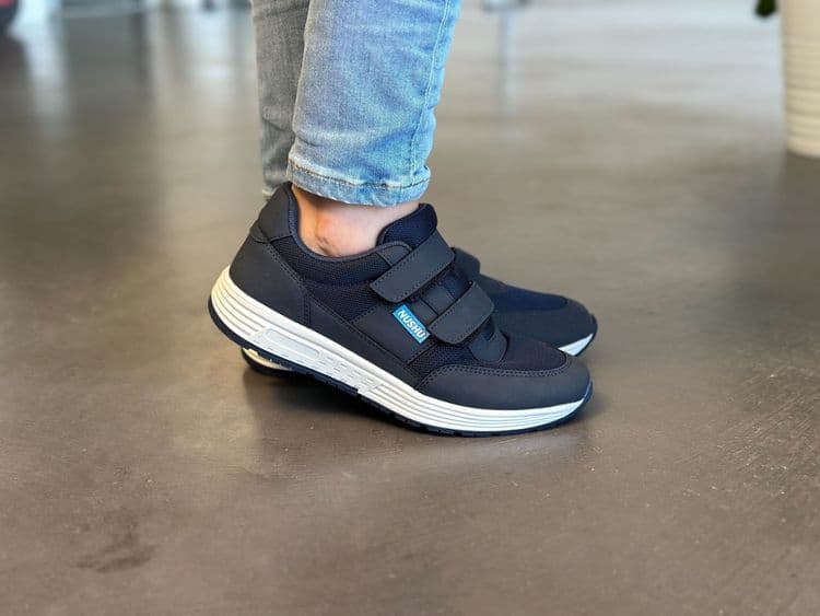 A photo of someone's feet wearing the Nushu X.